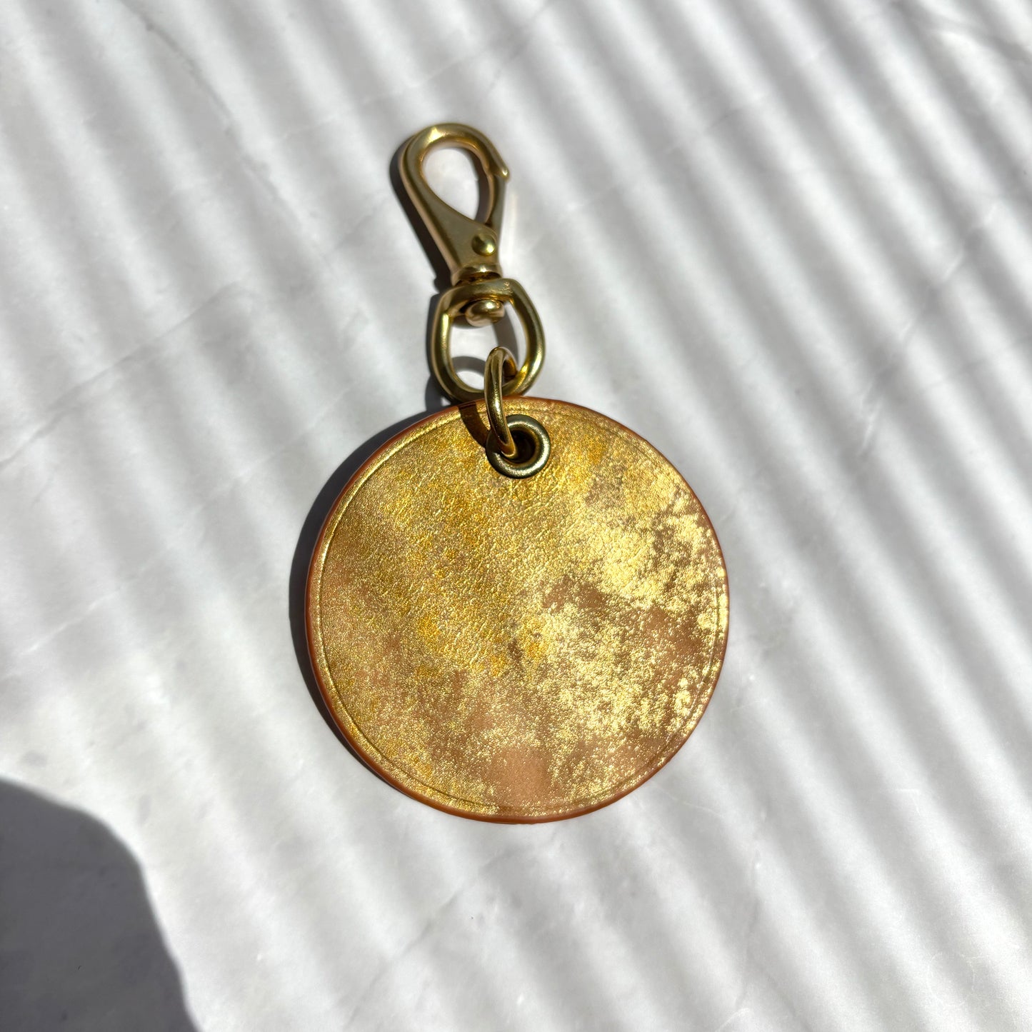 Gold medal charm